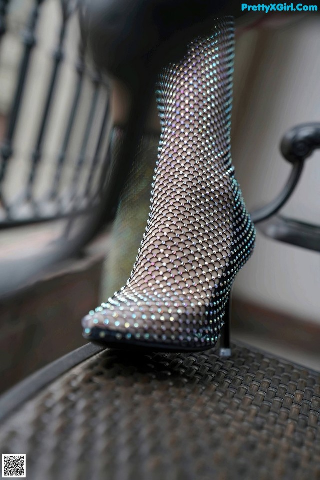 A close up of a pair of shoes on a chair.