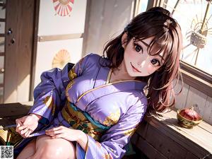 A woman in a blue kimono is standing in front of a white background.