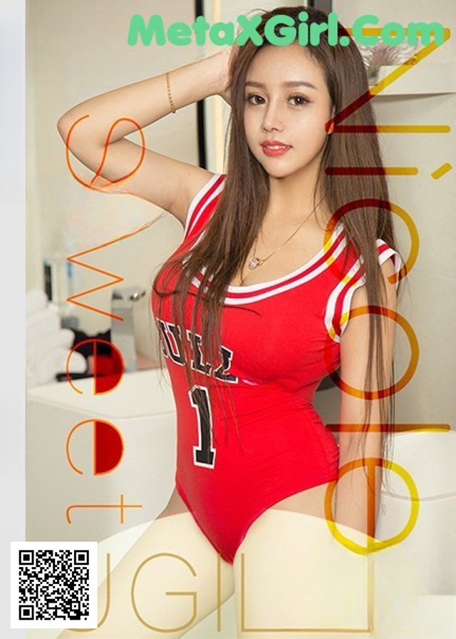 a woman in a red bodysuit posing for a picture