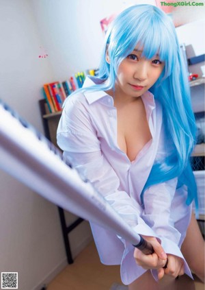 A collage of four pictures of a woman with blue hair.