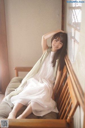 A woman laying on the floor looking at the camera.